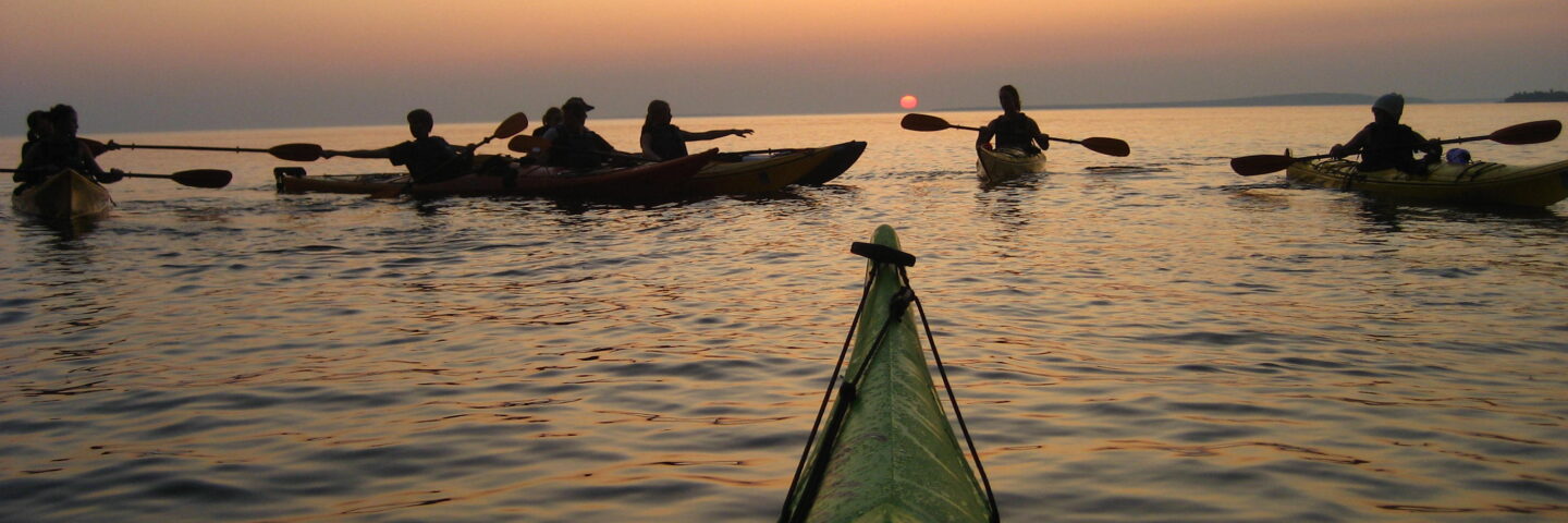people kayaking on lake superior
